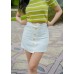 Skirt with full row of decorative buttoned double pockets