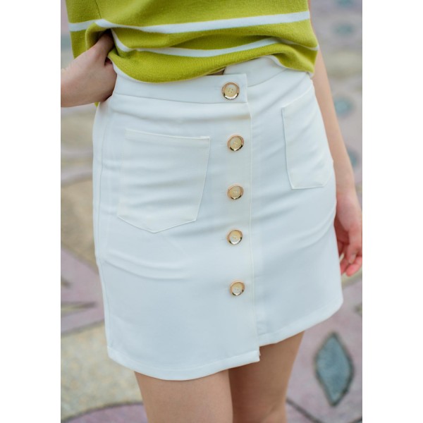 Skirt with full row of decorative buttoned double pockets