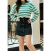 Skirt with full row of decorative buttoned double pockets
